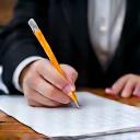 Stylist taking notes during client discovery